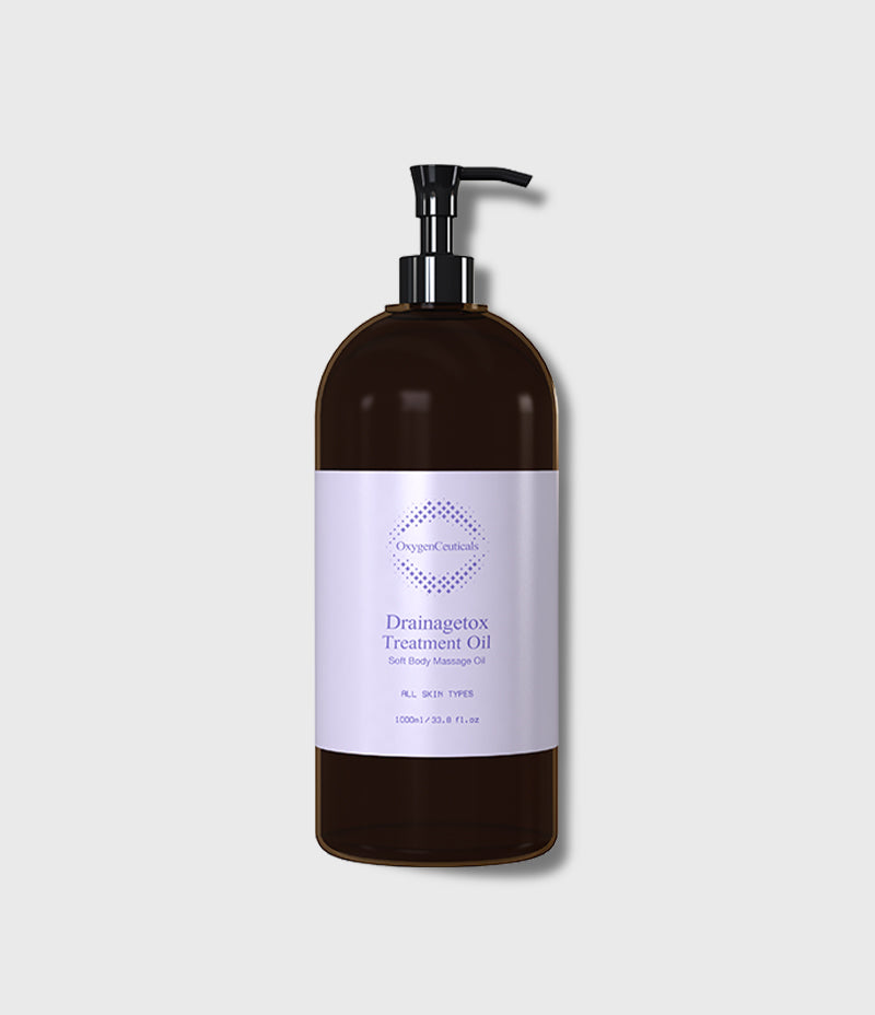 Drainagetox Treatment Oil 1000ml 深棕色泵头瓶正面，标签印 Soft Body Massage Oil