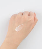 Hydra Soothing Essence Forte milky texture on hand